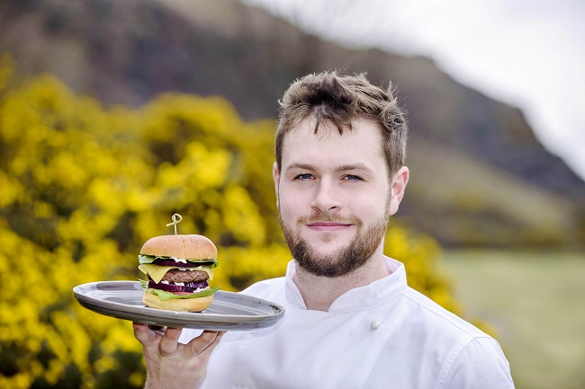 Chef Ambassador Fraser Cameron holding the Galloway Gourmet Burger