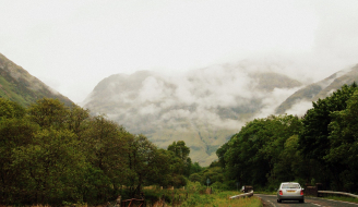 View from passenger seat of car in rural Scotland