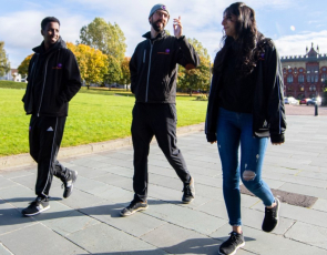 Three people walking outside