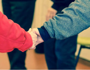 Elderly people holding hands