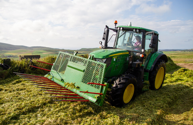 Woman driving tractor