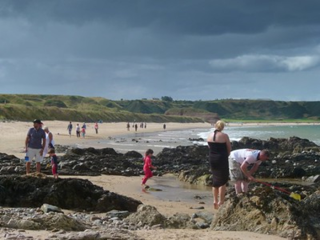 Families enjoying a visit to the beach