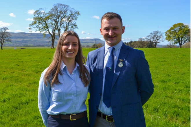 Jillian and Ally standing in field on a sunny day