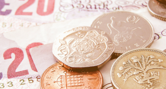 Close up of pounds notes and coins