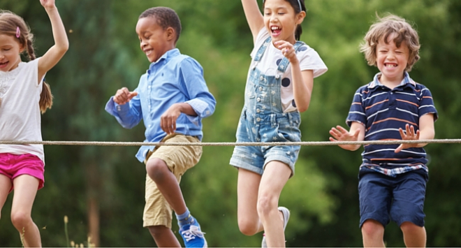 Children running towards finishing line in race