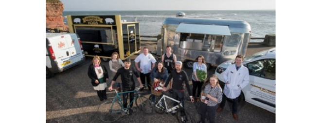 Food for Life group photo in front of food vans 