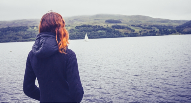 Girl looking out into loch