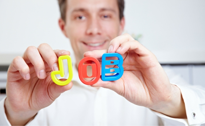 Man holding letters spelling out the word job