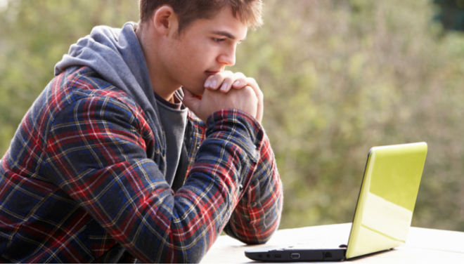 Man using laptop outside