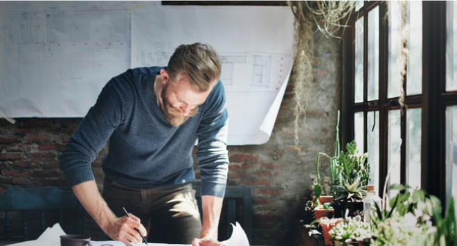 Man looking at architectural drawings