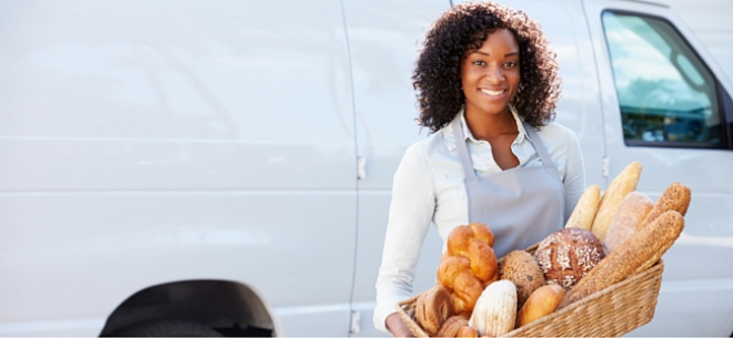 Woman carrying basket of bread