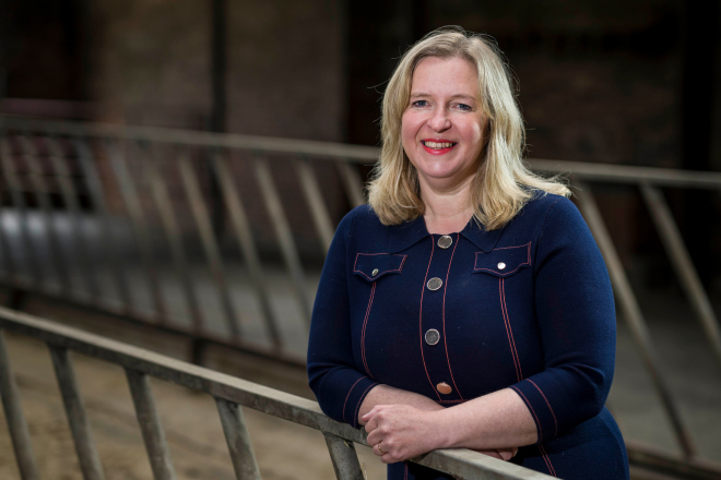 Caroline Millar standing in agricultural building