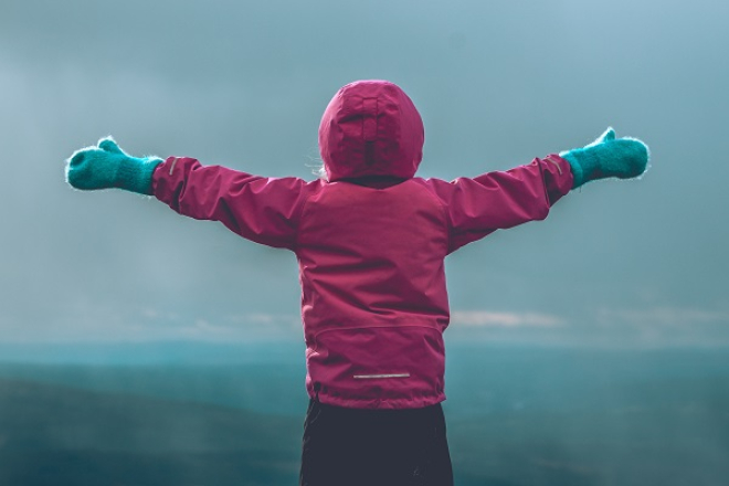 Child in winter clothes Photo by Erik Odiin (Unsplash)