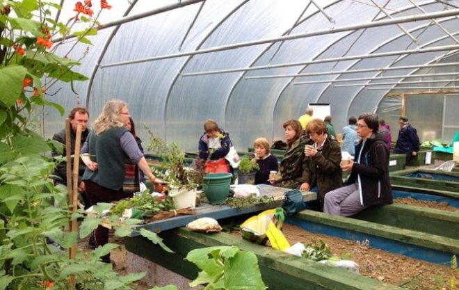 Photo of people in a garden in Colglen discussing climate change