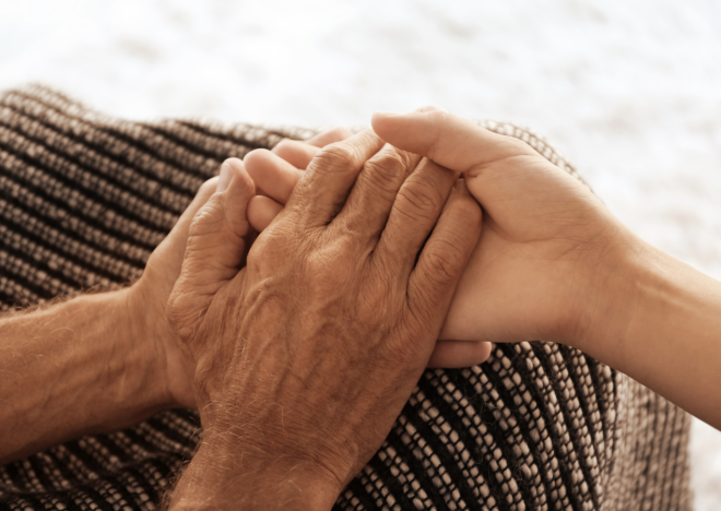 Old Hands Holding Young Hands Close up View