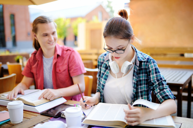 Teenager Studying in Cafe 