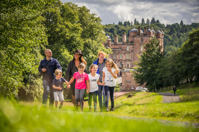 family walking in front of castle 