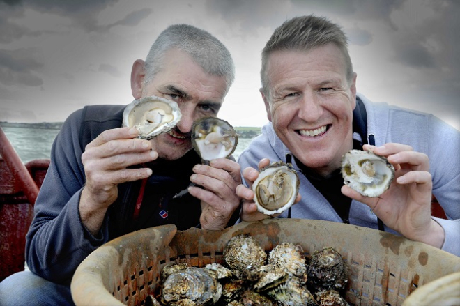 Pictured aboard the “Vital Spark”, a Stranraer based fishing vessel gathering the first oyster haul of the season are Allan Jenkins (left, project manager for Stranraer Development Trust, the community organisation that runs the oyster festival) and Vital Spark captain and oyster fisherman Rab Lamont. 