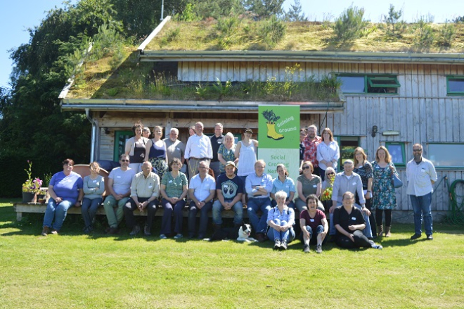 group photo of Gaining ground event participants in front of Glachbeg Croft building