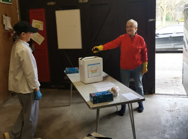 Person purchasing food from farmer's market