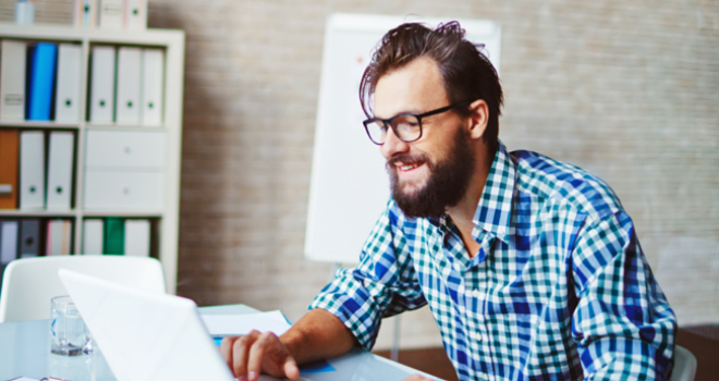 Person in home office looking at computer