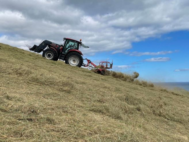 Tractor climbing steep field