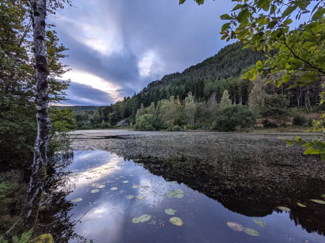 Reflection of hill in Cally Loch