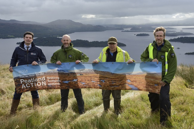 People holding Peatland Action banner