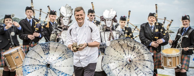 Chef with oysters and pipe band