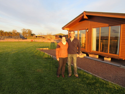 James and Kay Gilchrist outside a chalet