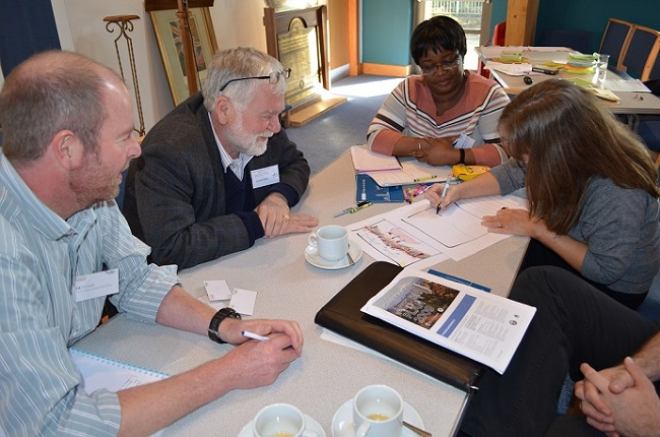 People sitting round table making plan