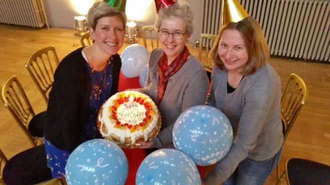 Anne Rowe, Sandra Hogg and Rhonda Mclean of Funding Scotland celebrate with a birthday cake