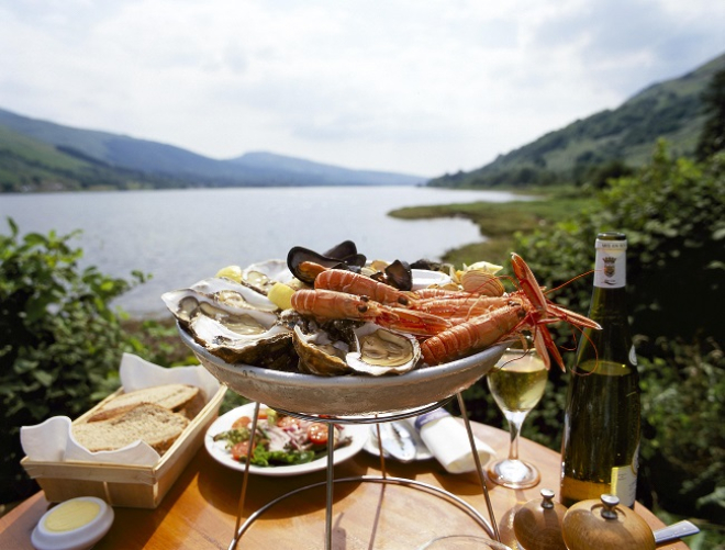 seafood platter sitting on table overlooking loch