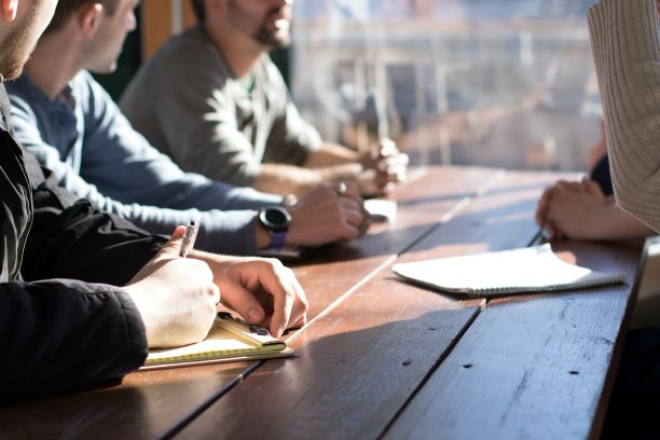 people talking round a table