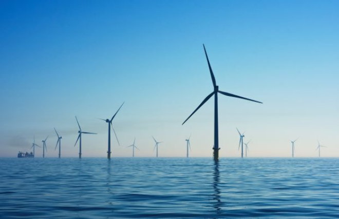 Offshore windfarm in calm blue waters