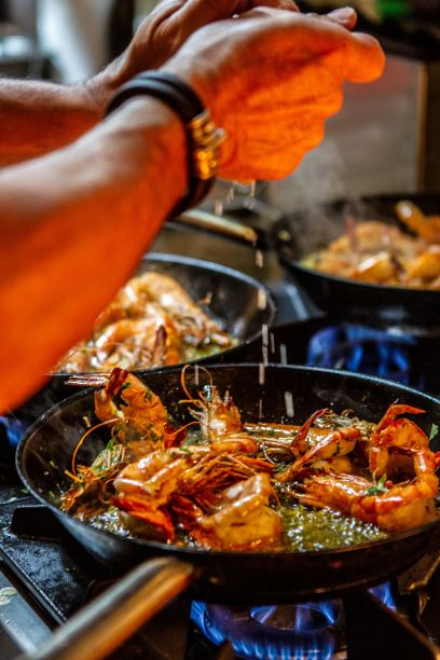 seafood being cooked in hot pan