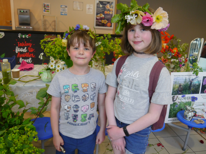 Two young attendees wearing their flower crowns at the Alive with local food launch