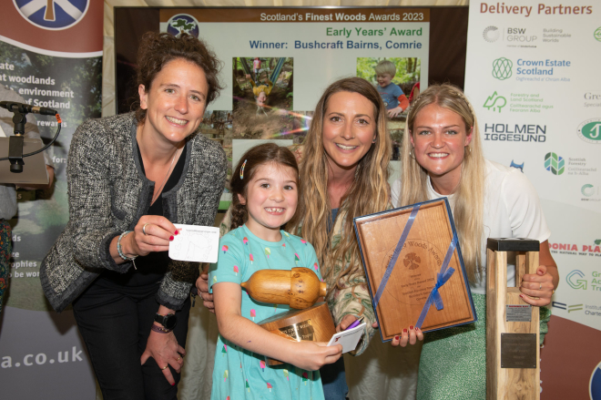 Rural Affairs Secretary Mairi Gougeon presenting Scottish Forestry Early Years’ Trophy to Bushcraft Bairns, Comrie Croft, Perthshire