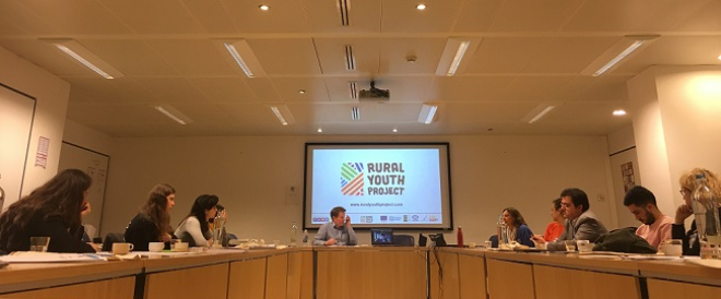 Brussels event with Rural Youth Project logo showing on screen