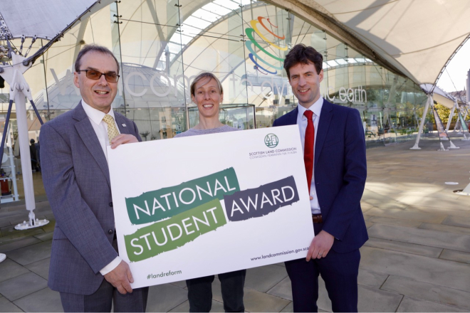 Scottish Land Commission representatives holding National Student Award sign