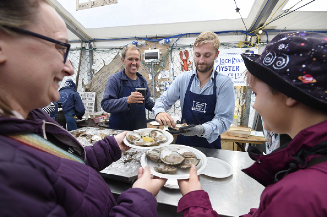 Shucking Champion Alexander Wallace serves oysters