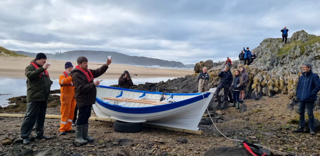 Jeff Mackie Boat Builder Toasting 'Grace' - Image by Strathnaver Museum 