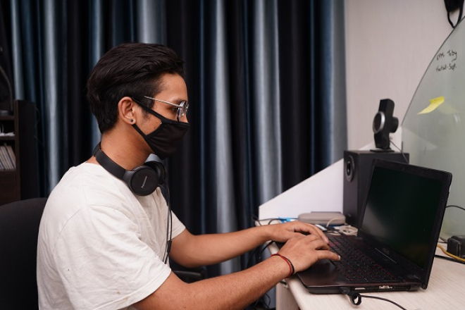 Young person on laptop Photo by Yogendra Singh