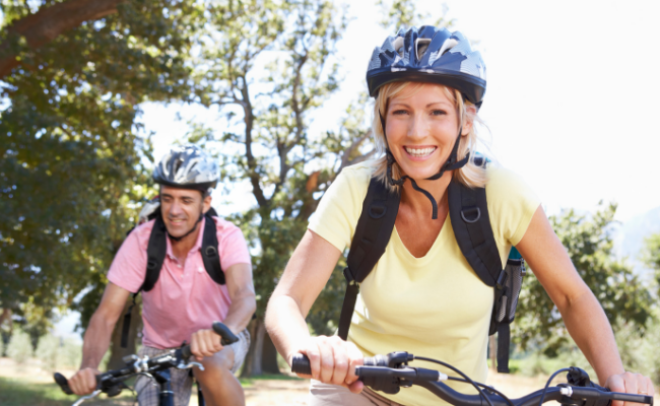 Woman and man cycling 