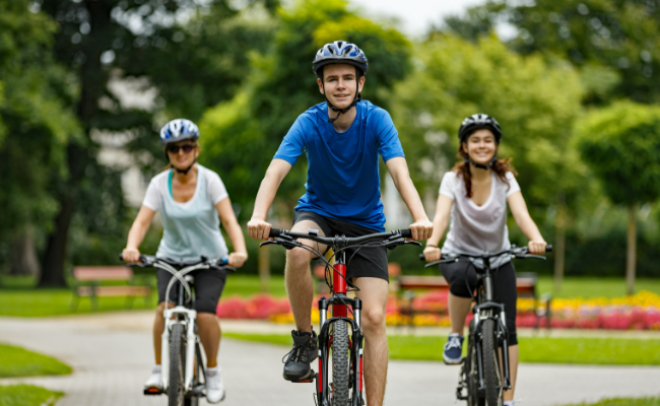 young people on bikes in the park