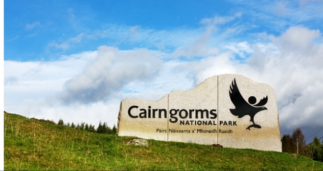 Cairngorms National Park sign on hillside