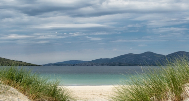 Coastal landscape with sand dunes in foreground