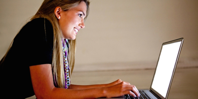 Woman looking at laptop