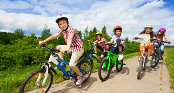 Children riding bikes on cycle path