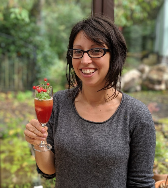 Rox Madeira of Trossachs Wild Apothecary holding a cocktail